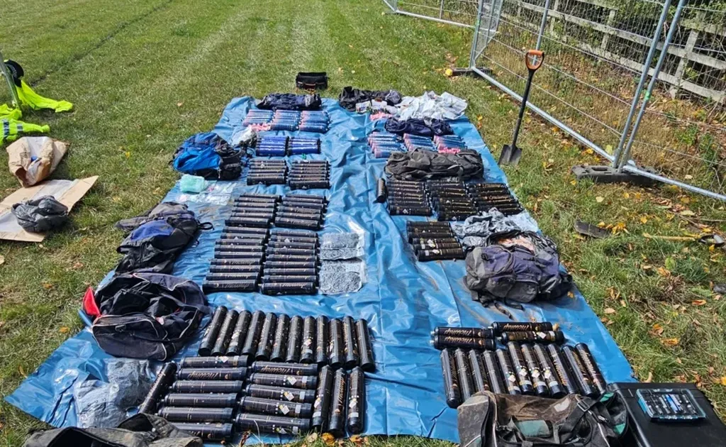 Police search bags recovered from beneath the Creamfields festival site